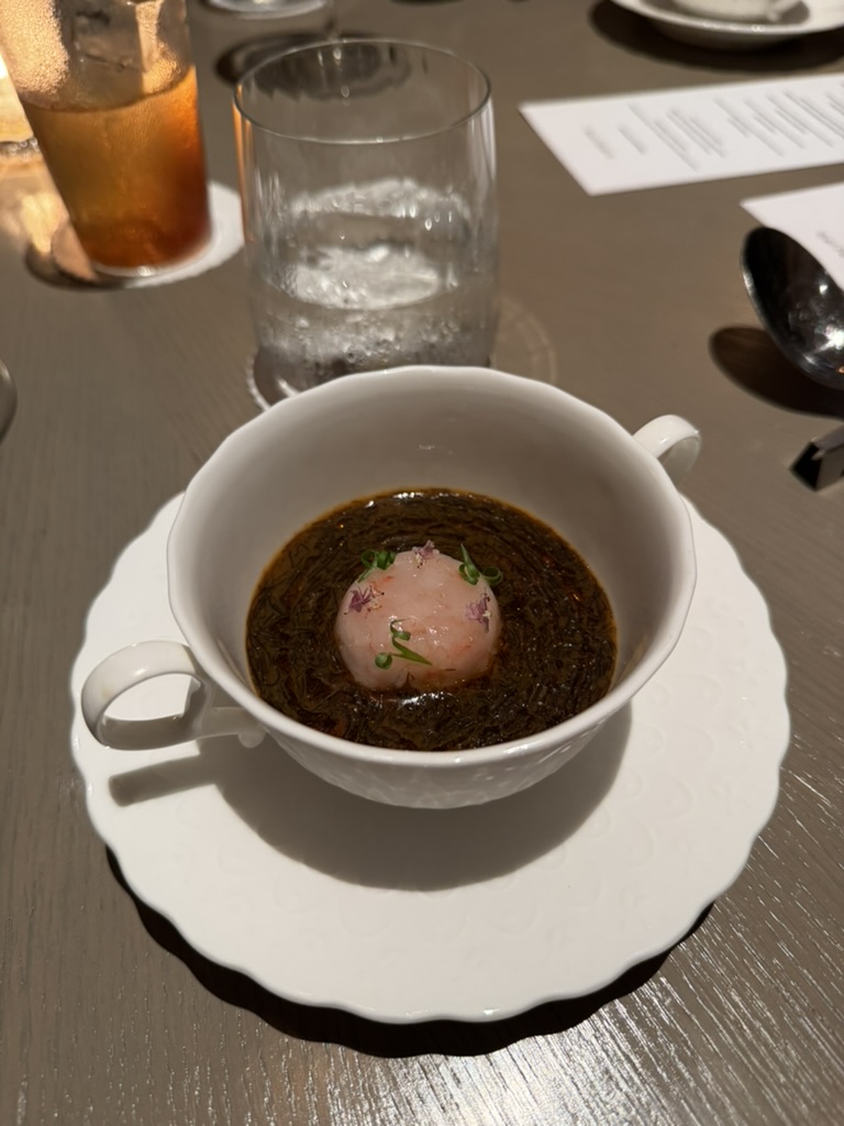 Crab custard course served in a white cup at Kindling Jakarta