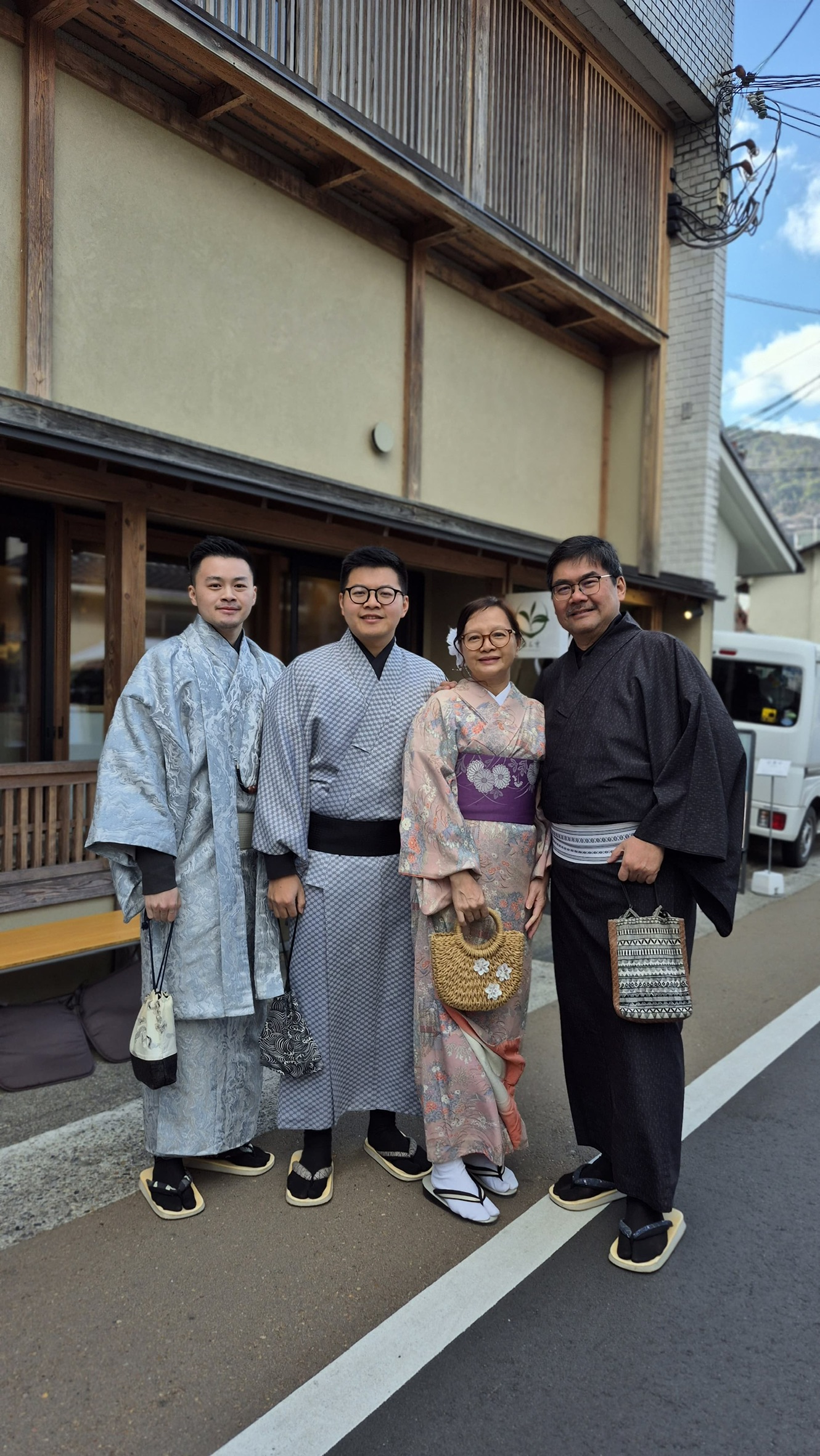 Family wearing rented kimonos on a Kyoto street