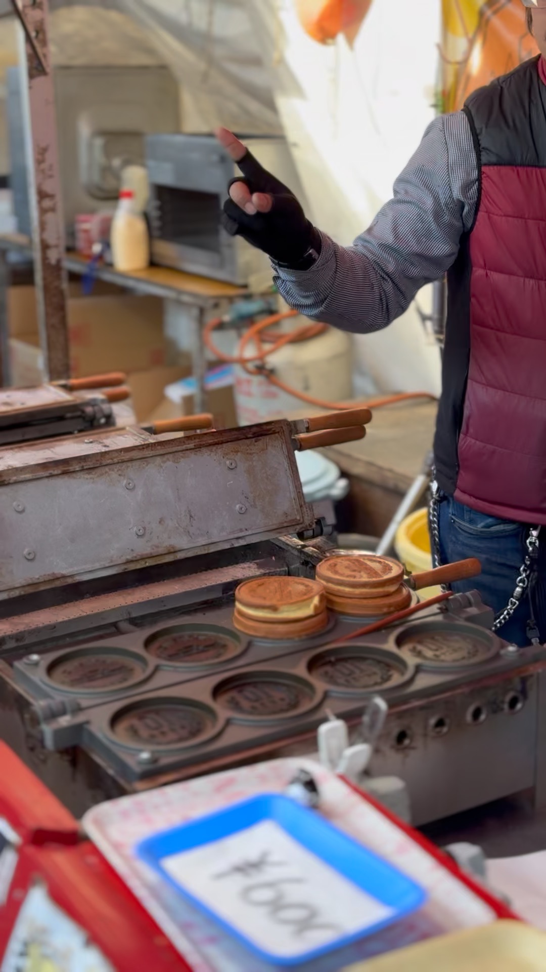 Taiyaki being cooked in a street stall mold in Kyoto