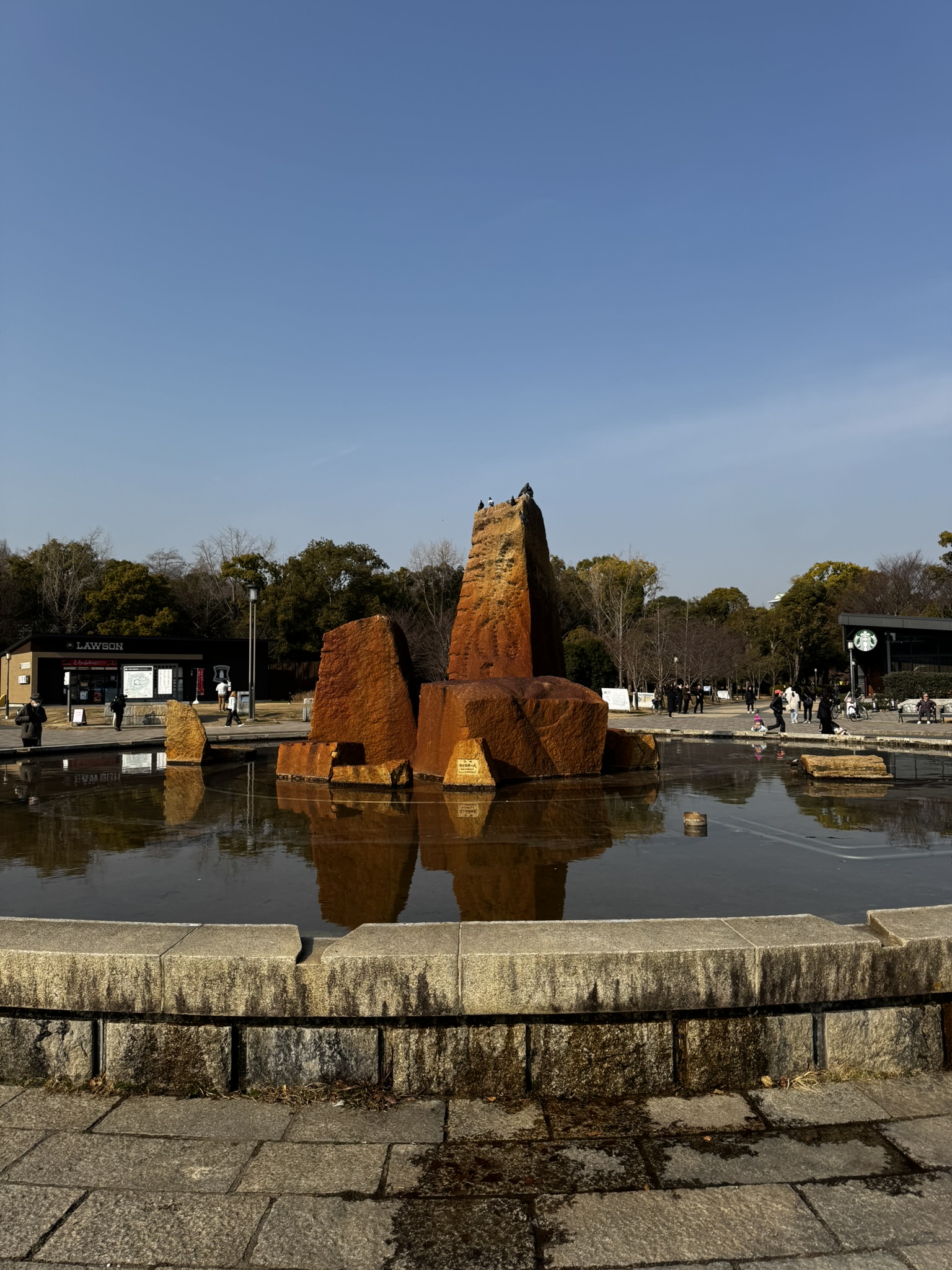 Stone sculpture and pond in Osaka Castle Park