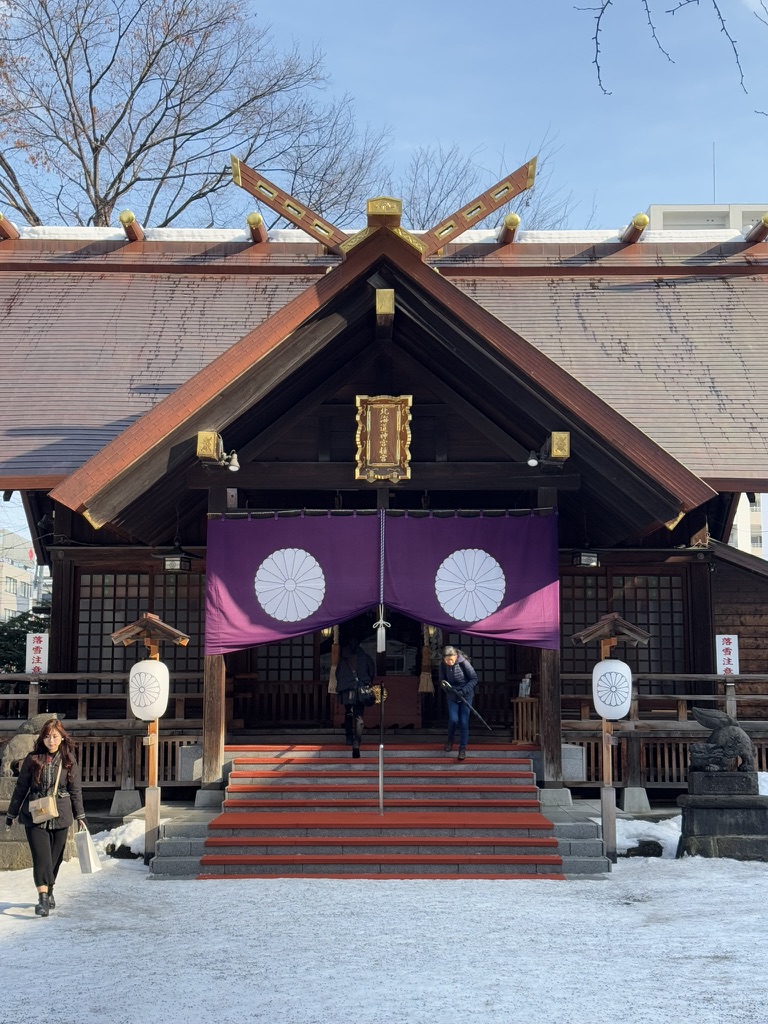 Hokkaido Jingu Shrine main hall with purple curtain and snow on the ground