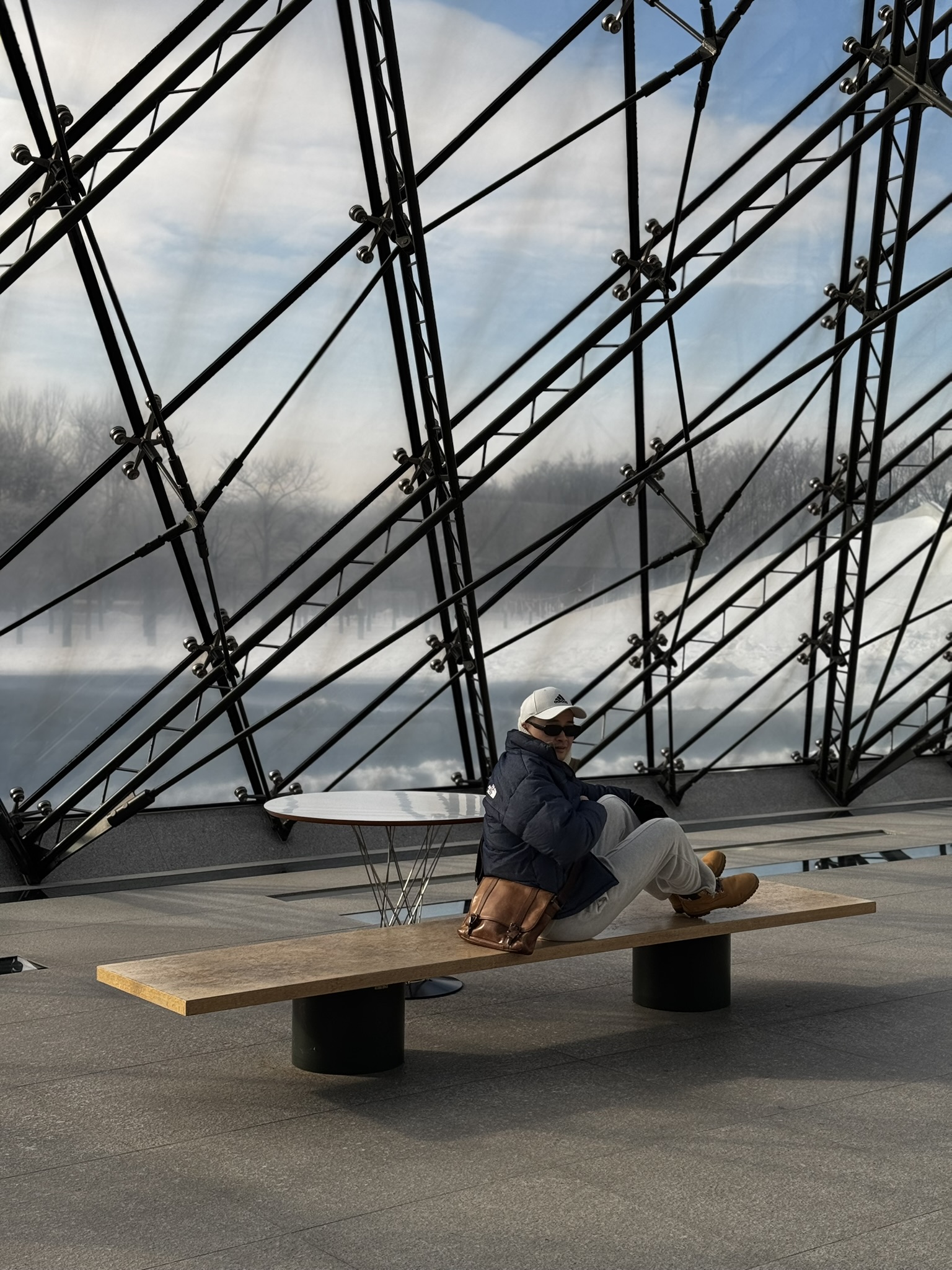 Inside Moerenuma Park glass pyramid with geometric black frames