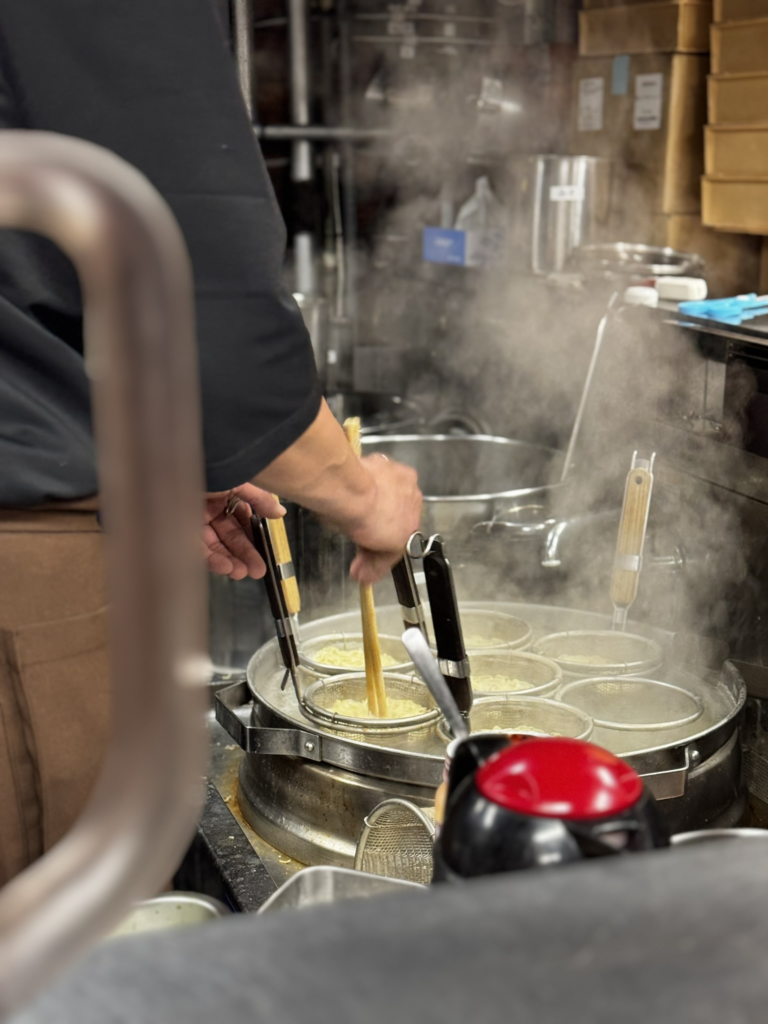 Steam rising while ramen noodles are being cooked