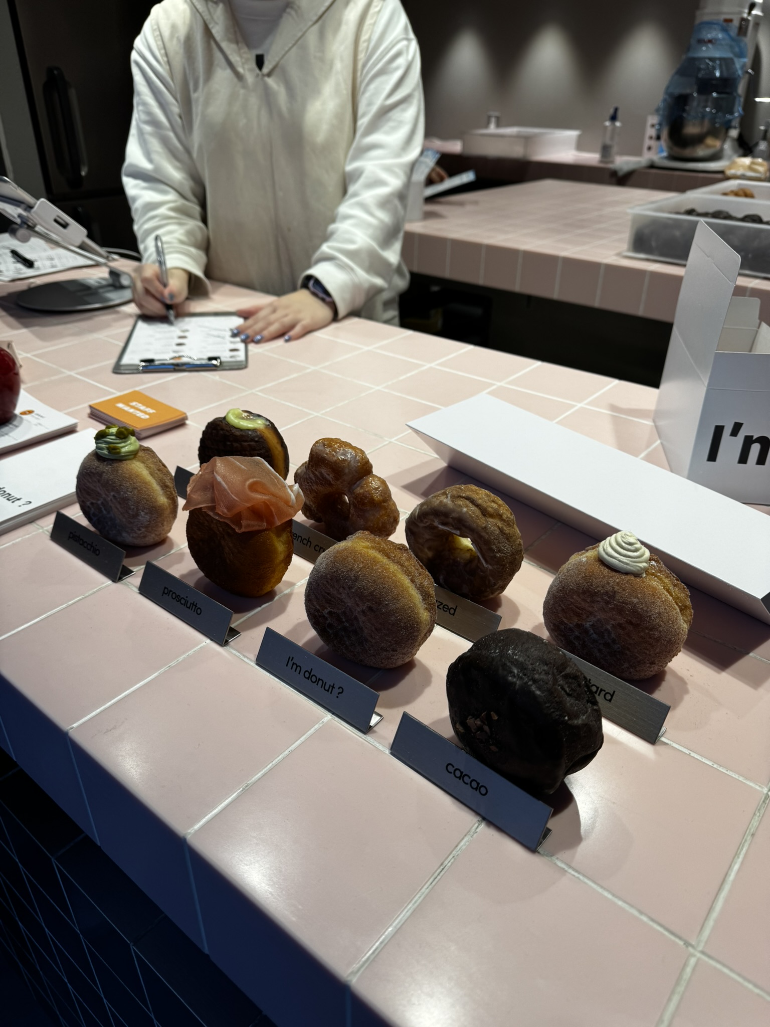 I'm donut? counter display with sweet and savory donuts