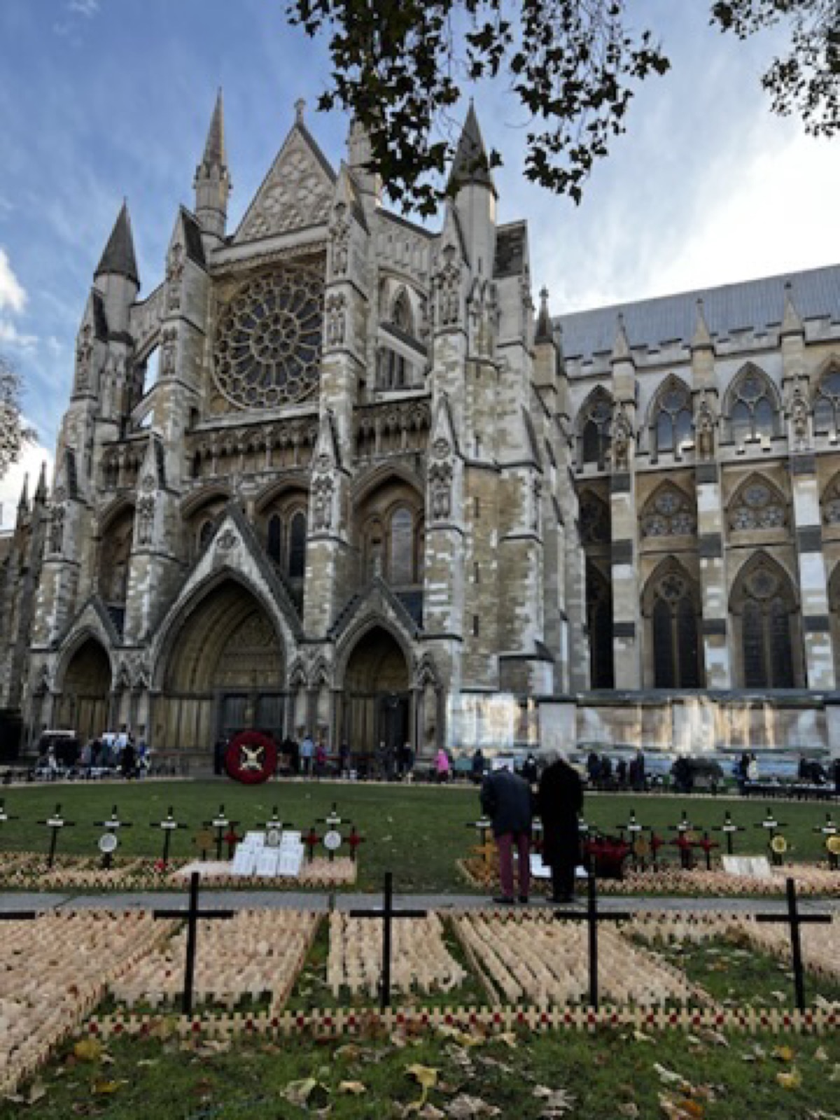 Westminster Abbey facade under a pale London sky
